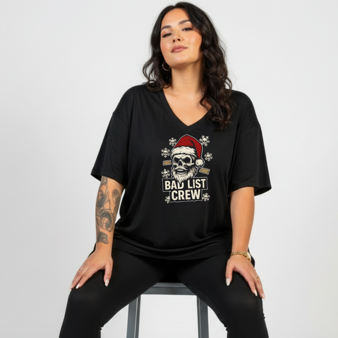 Woman wearing a black t-shirt with a graphic design and text on a white background