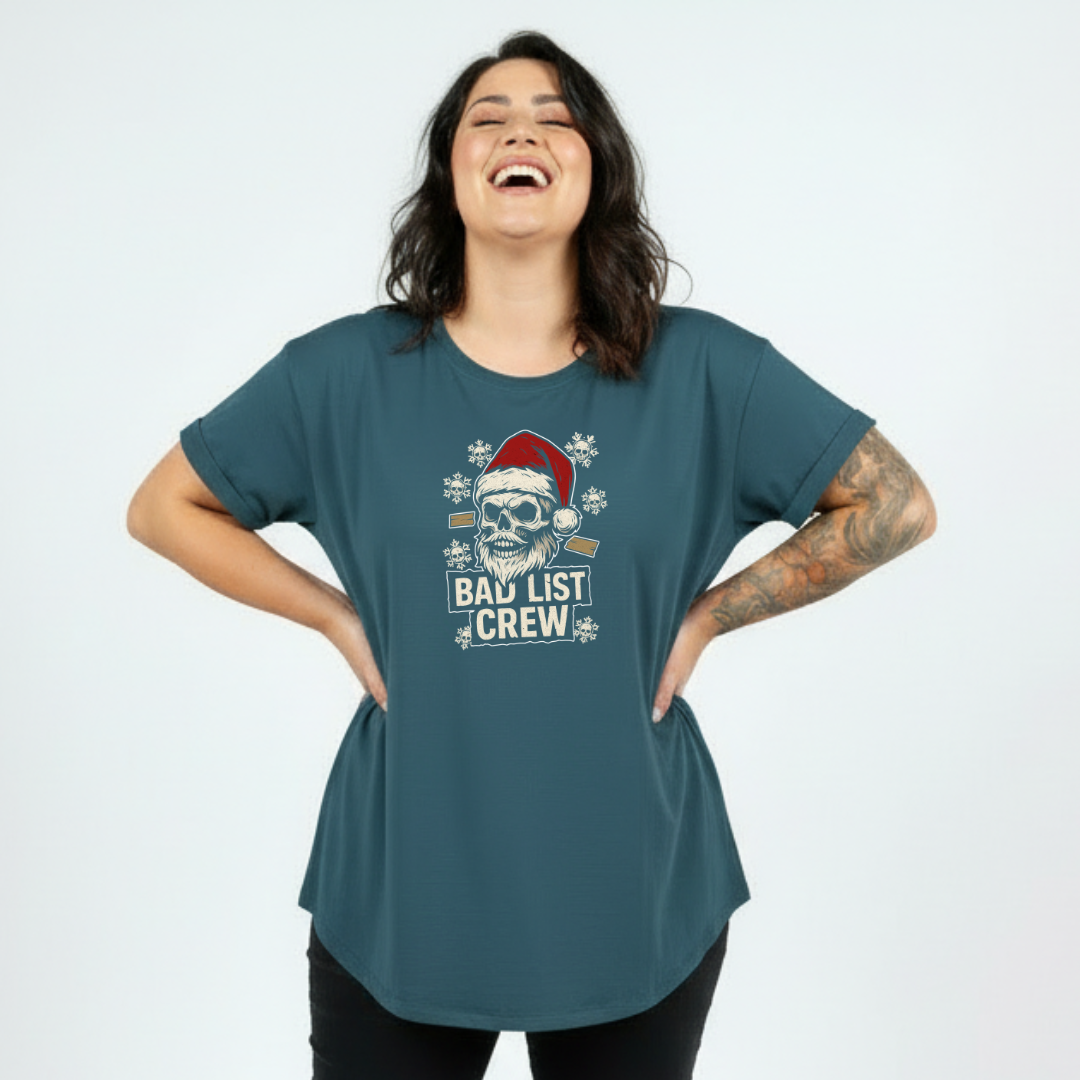 Woman wearing a teal t-shirt with a graphic design and text on a light blue background