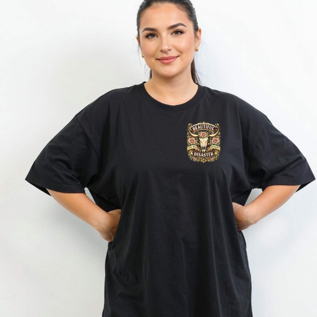 Woman wearing a black t-shirt with a gold graphic design on a white background