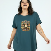 Woman wearing a teal t-shirt with a graphic design on a white background