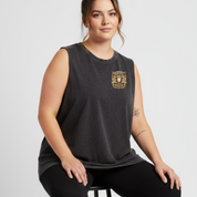 Woman wearing a black sleeveless shirt with a logo on a white background