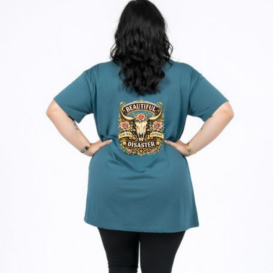 Person wearing a teal t-shirt with a graphic design on the back
