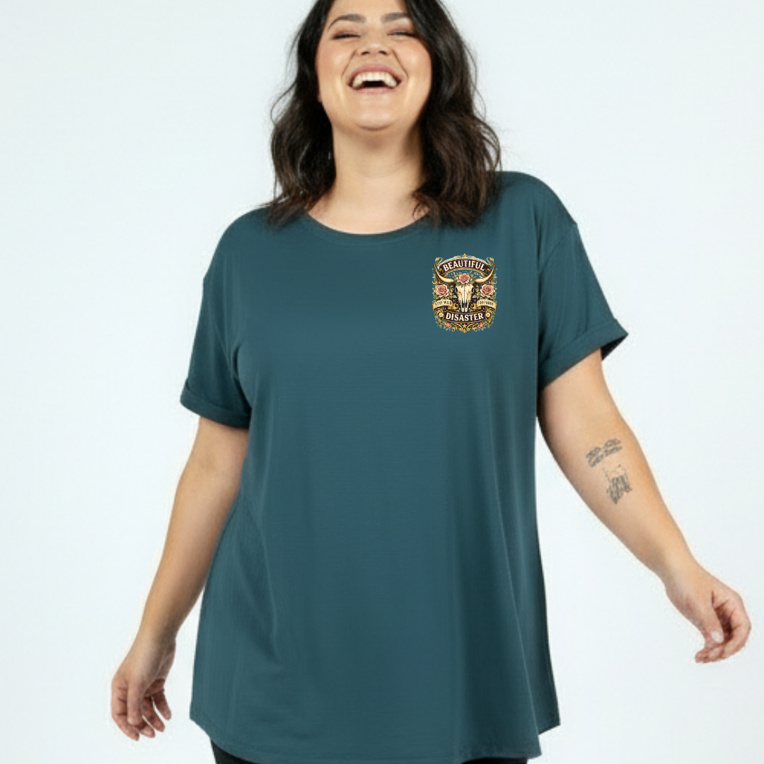 Woman wearing a teal t-shirt with a logo on a white background