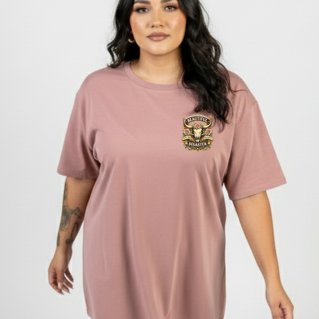 Woman wearing a mauve t-shirt with a graphic design on a white background