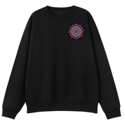 A black crewneck sweatshirt with a small circular mandala graphic on the left chest in shades of purple, pink, and white, displayed against a solid white background.