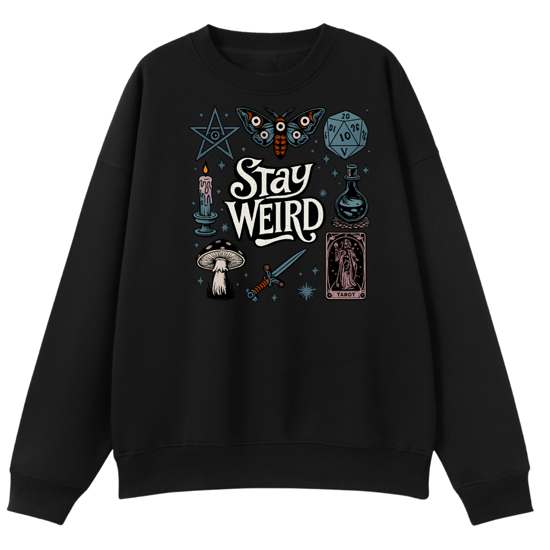 A black crewneck sweatshirt featuring a gothic-themed graphic print on the front with the words 'Stay Weird' surrounded by illustrations of a butterfly, a d20 die, a candle, a mushroom, a sword, a tarot card, and a pentagram.