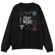A black crewneck sweatshirt featuring a gothic-themed graphic print on the front with the words 'Stay Weird' surrounded by illustrations of a butterfly, a d20 die, a candle, a mushroom, a sword, a tarot card, and a pentagram.