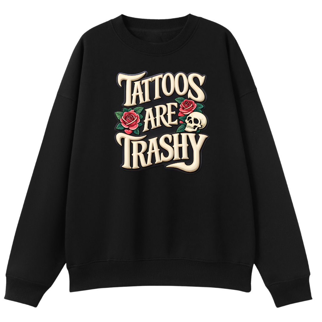 A black crewneck sweatshirt featuring a white graphic print of a skeleton in a coffin with flowers and the text 'SURVIVING PURELY OUT OF SPITE' on the front, displayed against a solid white background.