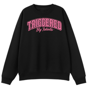 A black crewneck sweatshirt with 'TRIGGERED By Idiots' printed in pink across the chest, displayed on a clean white background.