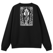 A black crewneck sweatshirt shown from the back, featuring a large white graphic print of a skeletal figure with a flaming head and the text 'BURNS SAGE & BRIDGES' on a plain white background.