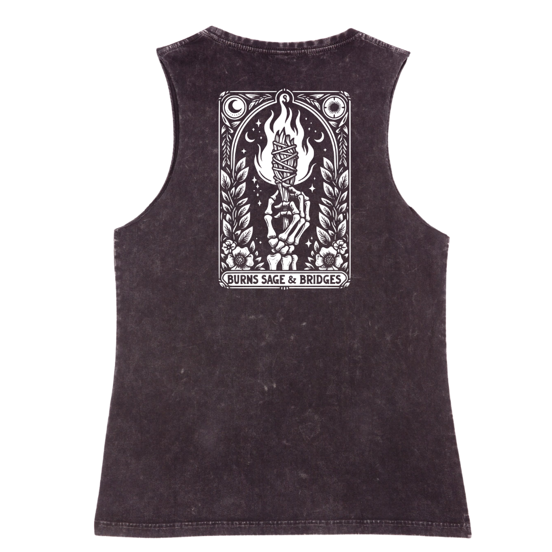 A sleeveless black tank top with a large white graphic print on the back, featuring a skeleton holding a flaming altar and the text 'BURNS SAGE & BRIDGES'.