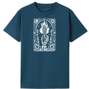 A dark teal blue short-sleeve t-shirt with a white graphic print on the chest. The graphic features a stylized illustration of a hand holding a lit candle with flames, surrounded by leaves and celestial symbols, with the text 'BURNS SAGE & BRIDGES' at the bottom.
