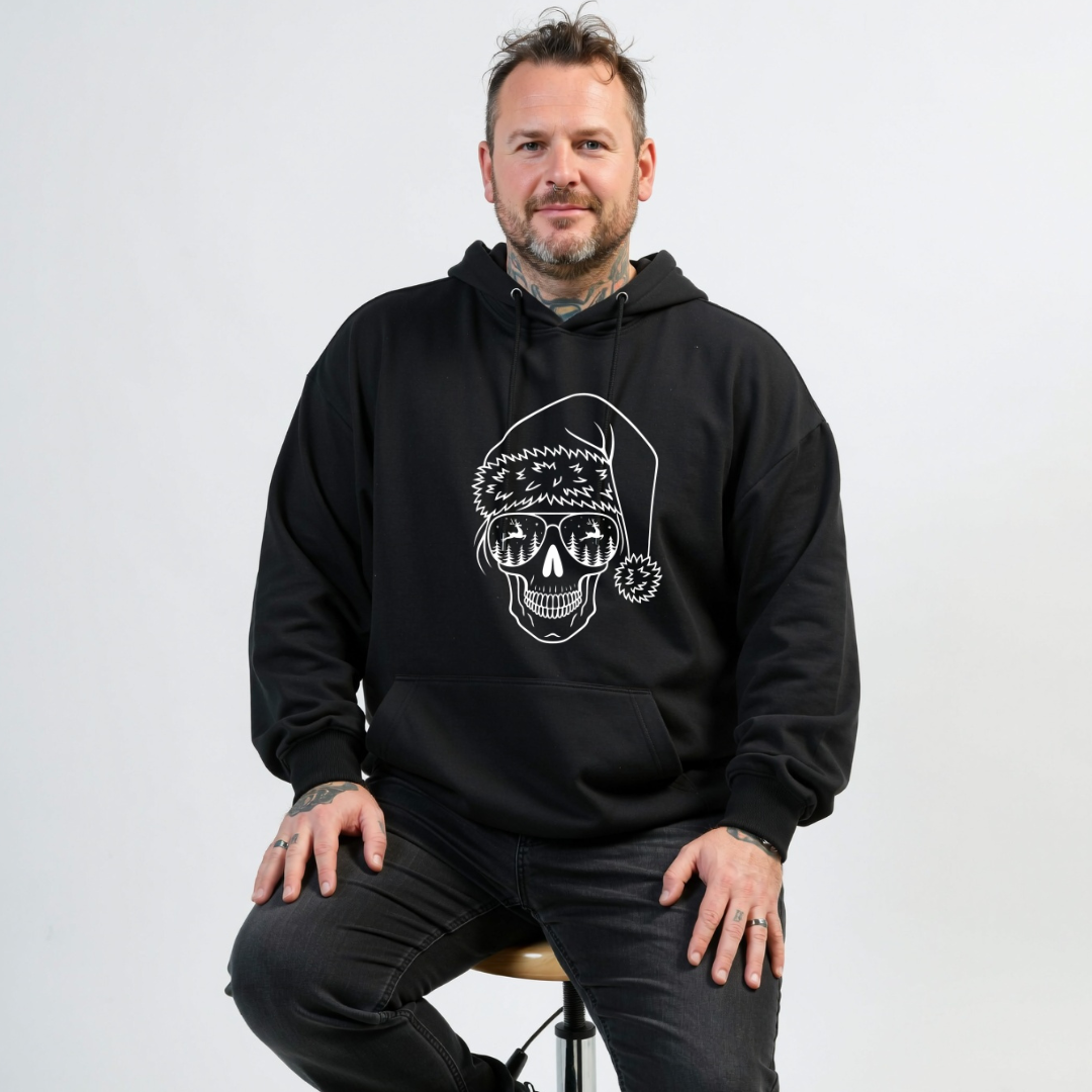 Man wearing a black hoodie with a skull design on a white background