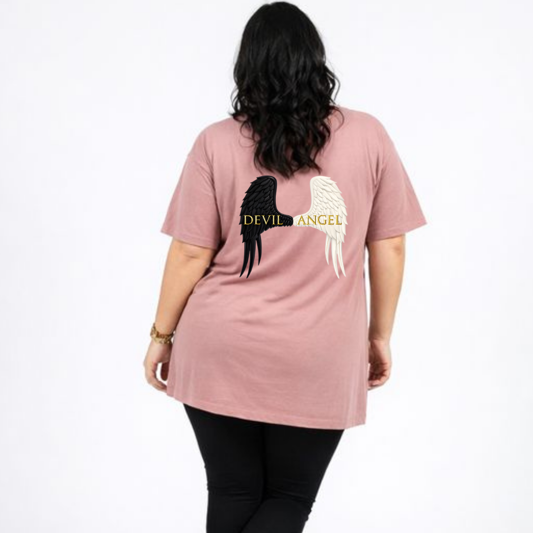 Person wearing a pink t-shirt with angel and devil wing designs on the back.