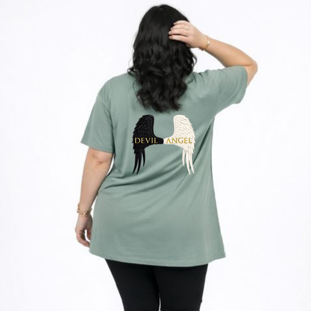 Person wearing a green t-shirt with 'Devil Angel' design on the back