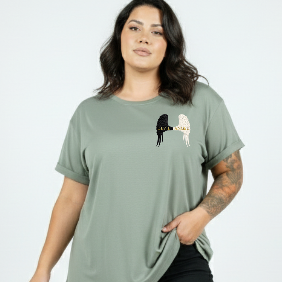 Woman wearing a green t-shirt with a graphic design on a plain background