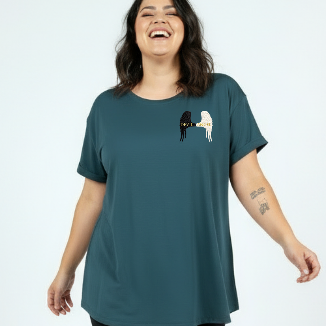 Woman wearing a teal t-shirt with a graphic design on a white background