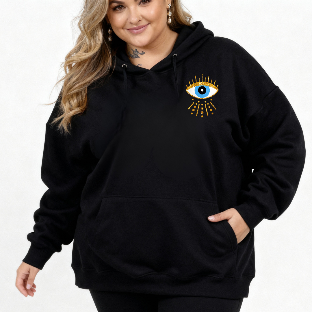 Person wearing a black hoodie with an eye design on a white background