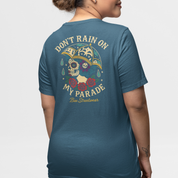 Unisex Teal tee showcasing a skull under umbrella, raindrop details and ‘Don’t Rain On My Parade’ lettering – handmade graphic tee for the fearless