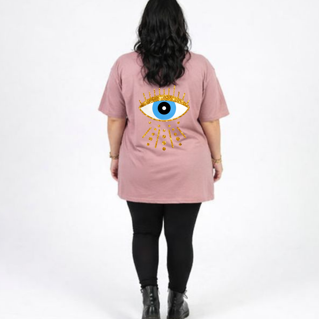 Person wearing a pink t-shirt with an eye design on the back, standing against a white background
