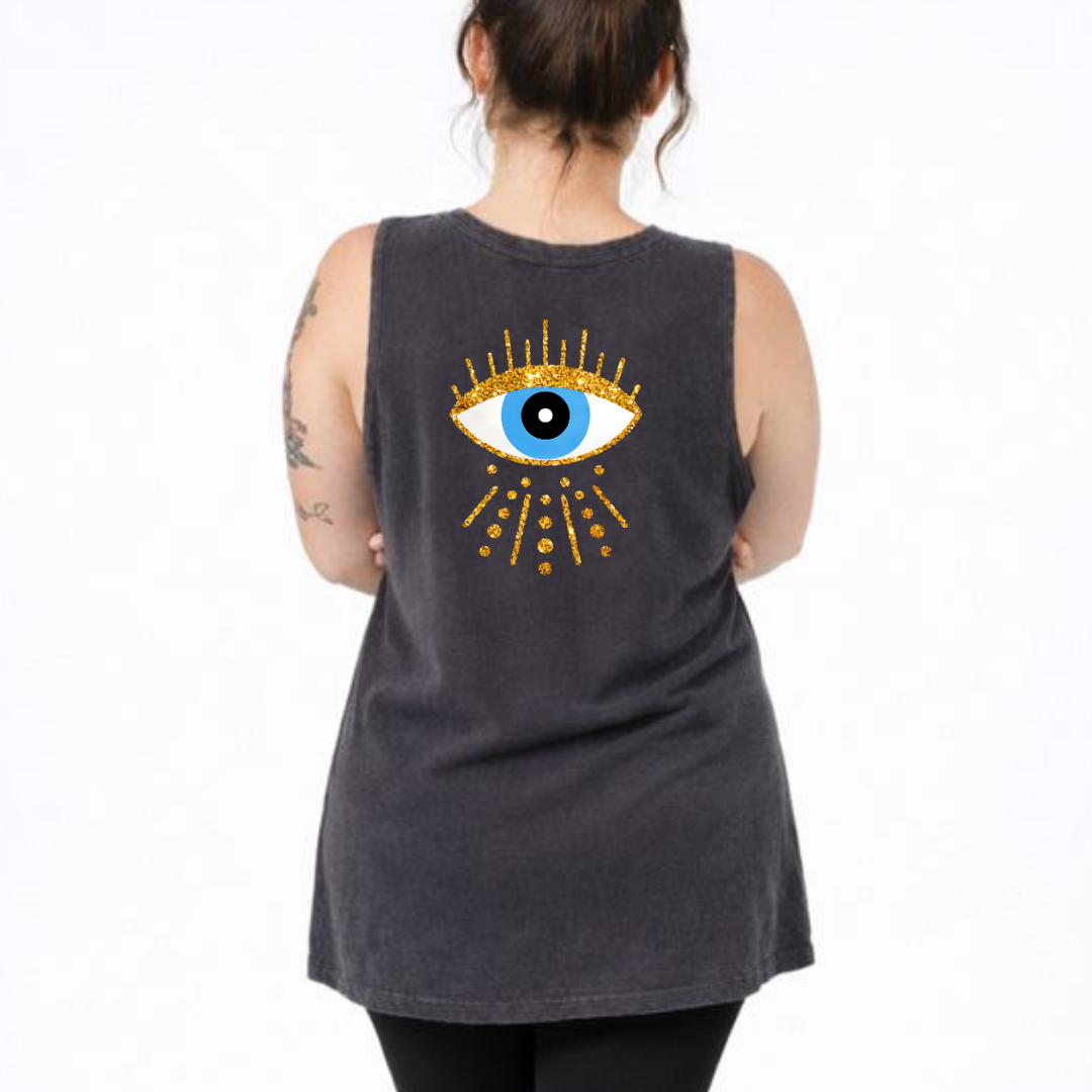 Person wearing a dark gray tank top with an eye design on the back against a white background