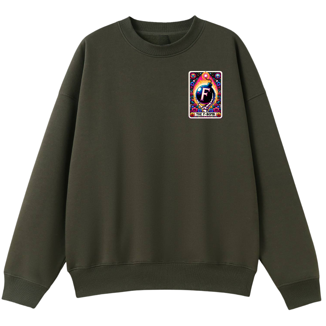 An olive green crewneck sweatshirt with a colorful graphic patch on the left chest featuring a stylized letter 'F' and Japanese text, displayed on a clean white background.