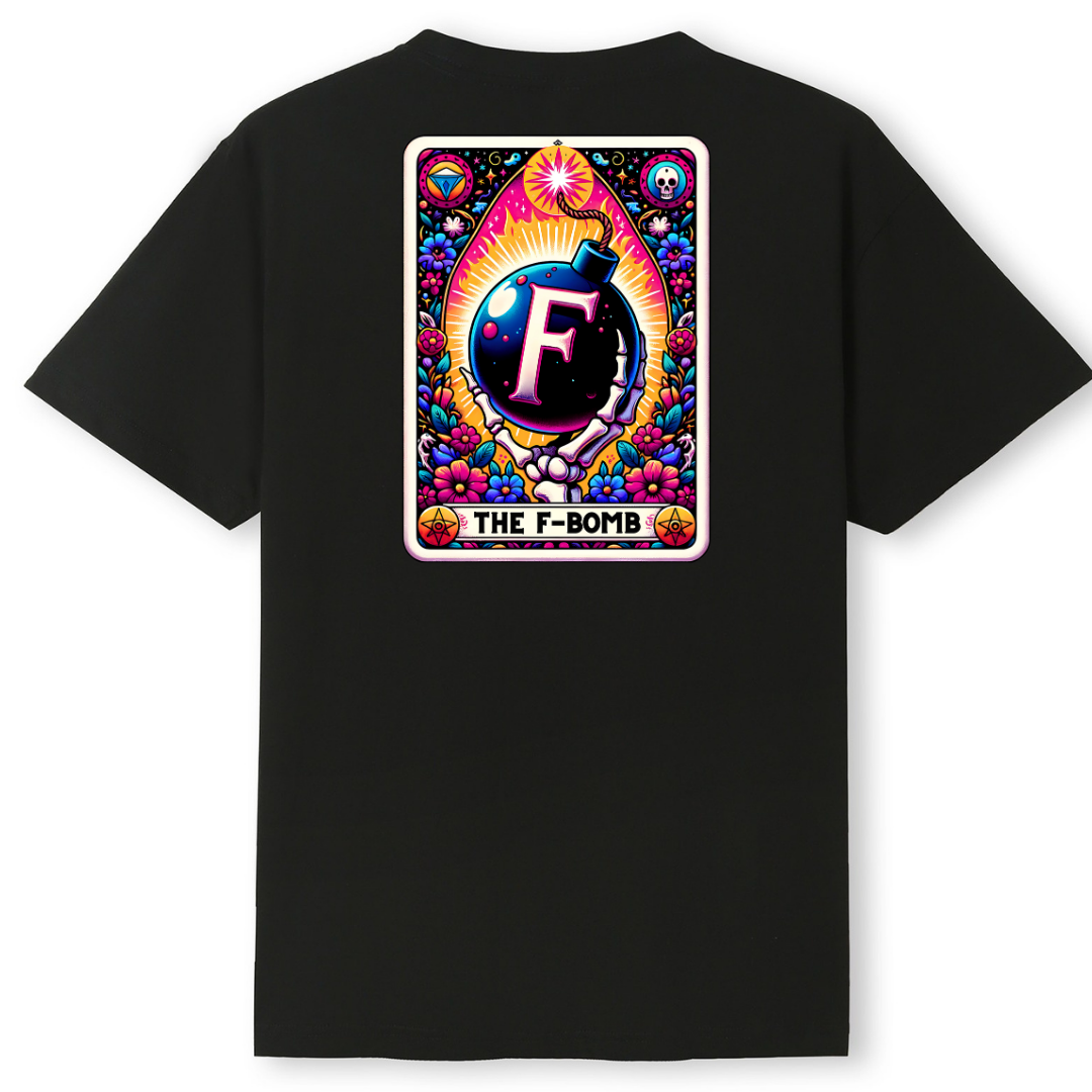 A black short-sleeve T-shirt shown flat against a white background, featuring a large colorful graphic print on the back. The graphic is styled like a retro card with a bomb illustration, a large letter F, and the text 'THE F-BOMB'.