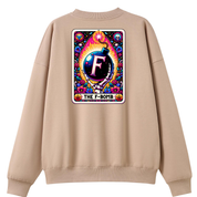 A beige crewneck sweatshirt shown from the back, featuring a large, colorful graphic print on the back. The graphic is styled like a retro card with the text 'THE F-BOMB' and a central bomb illustration with the letter 'F'.