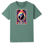 A sage green short-sleeve crewneck t-shirt featuring a colorful graphic print on the chest. The graphic is styled like a vintage tarot card with the letter 'F' in a bomb, surrounded by a rainbow of colors, and the text 'THE F-BOMB' at the bottom.