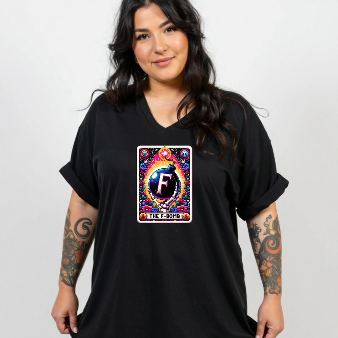 A woman wearing a black V-neck t-shirt with a colorful tarot card graphic on the chest that reads 'THE FLOWER' and features a stylized letter 'F'.