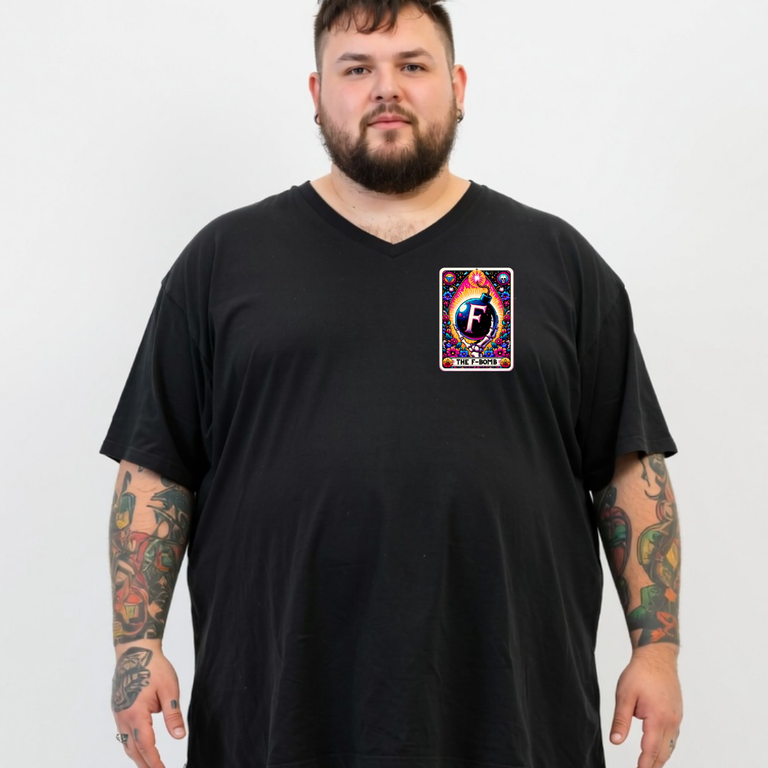 A man with a beard and tattoos wearing a black v-neck t-shirt with a colorful graphic print on the left chest. The graphic features a stylized letter 'F' inside a rainbow design with the text 'FUTURE FAN'.