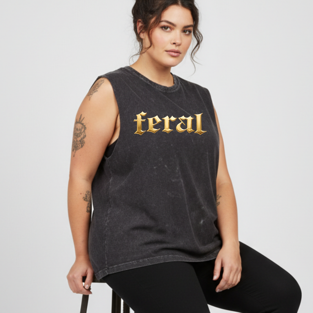 Woman wearing a black sleeveless shirt with 'feral' printed in gold on a white background