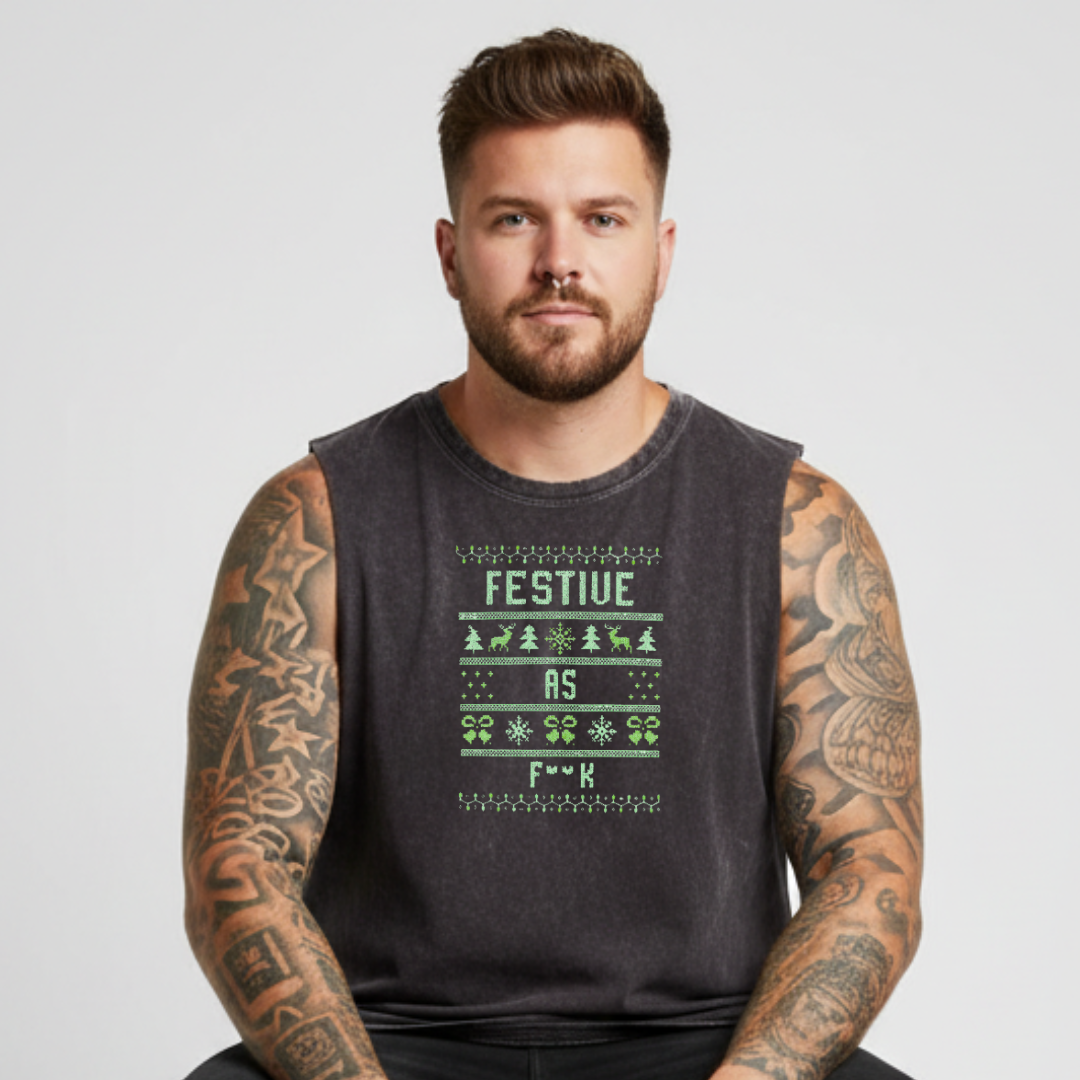 Man wearing a sleeveless black shirt with a festive design on a light gray background