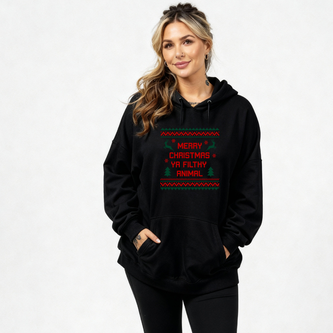 Woman wearing a black hoodie with Christmas-themed text on a white background
