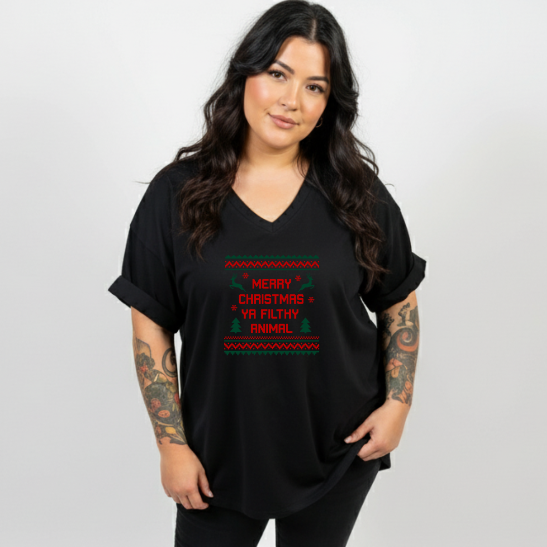 Woman wearing a black t-shirt with a Christmas-themed design on a white background