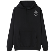 A black pullover hoodie with a small white line-art flower graphic on the left chest, displayed against a solid white background.