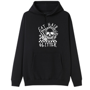 A black pullover hoodie with a white graphic print on the front featuring a skull, stars, and the text 'CAT HAIR IS MY GLITTER'.