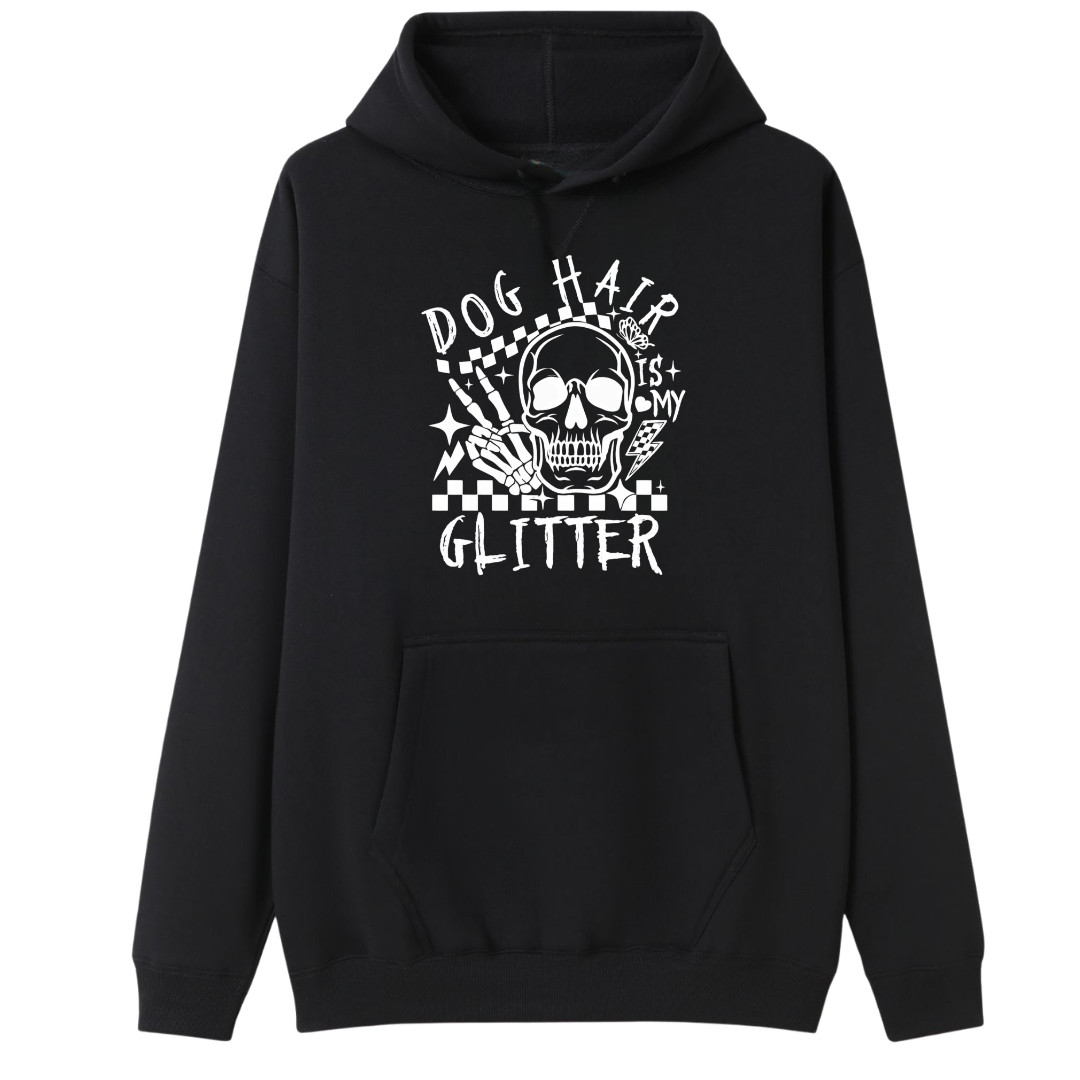 A black pullover hoodie with a white graphic print on the chest featuring a skull, stars, and the text 'DOG HAIR IS MY GLITTER'.