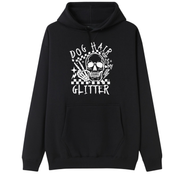 A black pullover hoodie with a white graphic print on the chest featuring a skull, stars, and the text 'DOG HAIR IS MY GLITTER'.