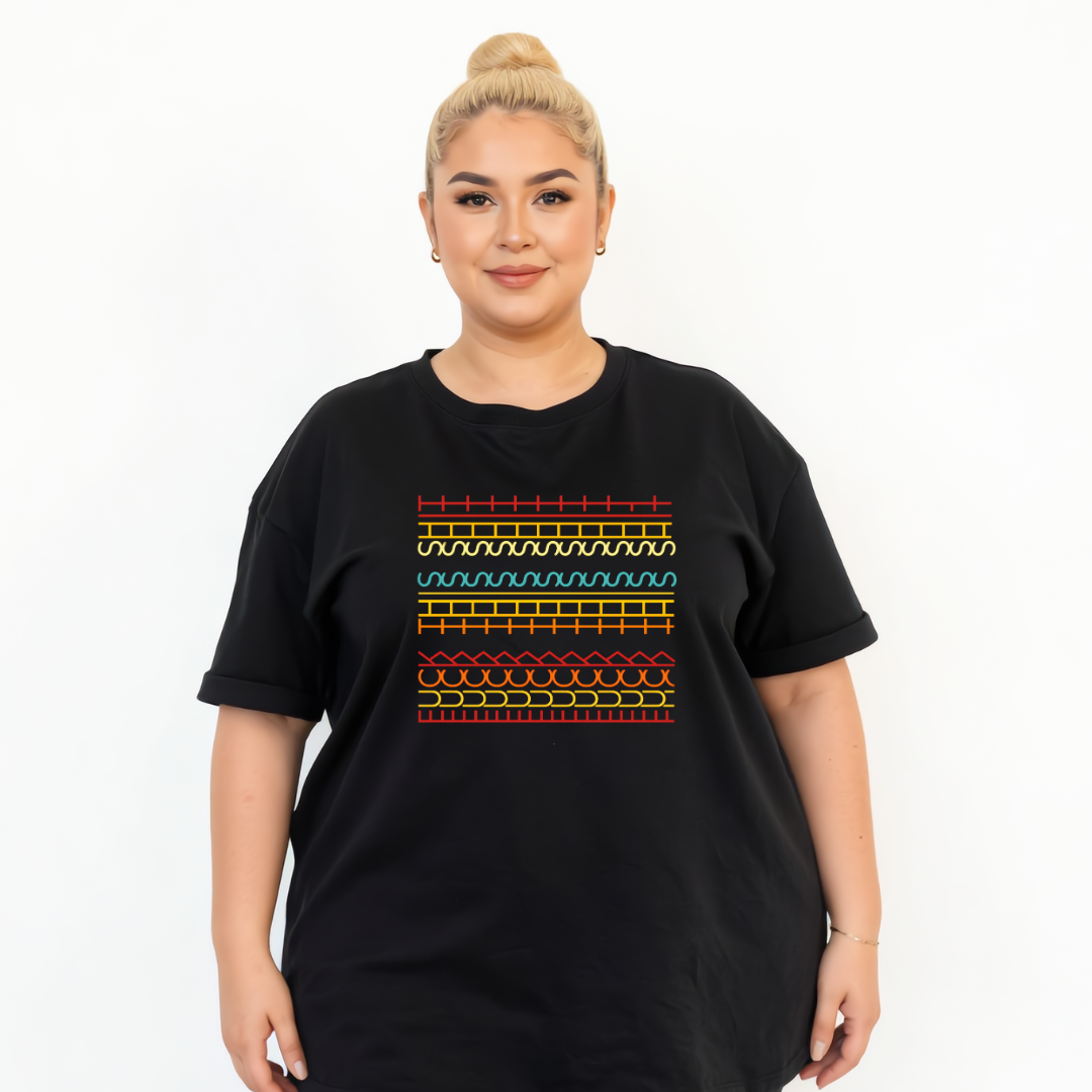 Person wearing a black t-shirt with colorful geometric pattern on a white background