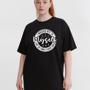 Person wearing a black t-shirt with white text on a plain background