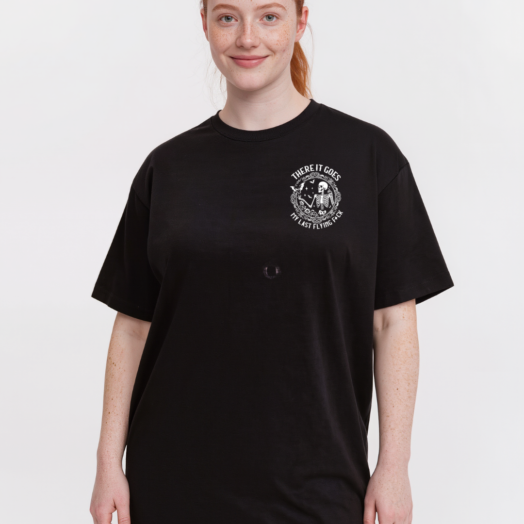 Person wearing a black t-shirt with a white graphic design on a white background