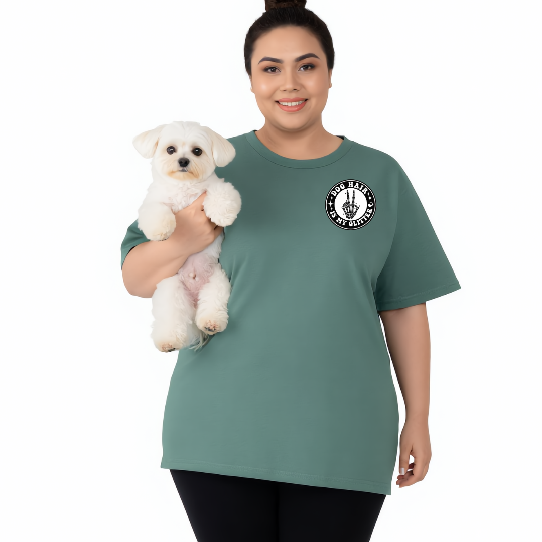 Woman wearing a green t-shirt with a logo, holding a small white dog on a white background