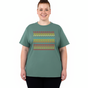 Person wearing a green t-shirt with colorful geometric pattern on a white background