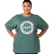 Person wearing a green t-shirt with a humorous graphic design on a white background