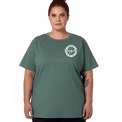 Person wearing a green t-shirt with a white graphic design on a white background