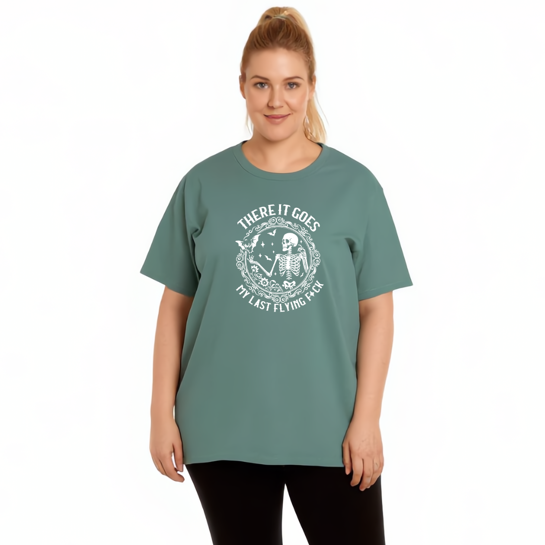 Person wearing a green t-shirt with a graphic design on a white background