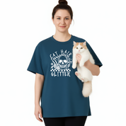 Woman wearing a blue t-shirt with a cat design, holding a white and orange cat.