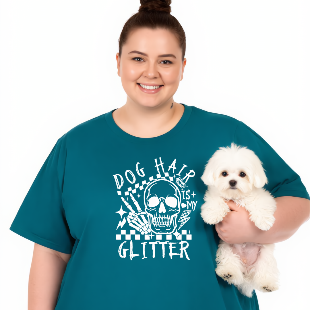 Person wearing a teal t-shirt with a graphic design holding a small white dog on a white background