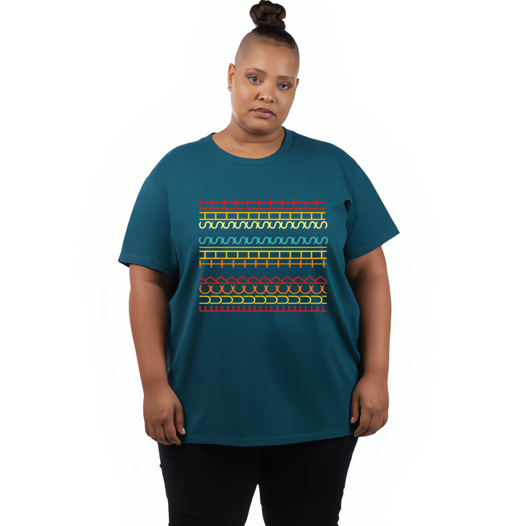 Person wearing a teal t-shirt with a colorful geometric pattern on a white background